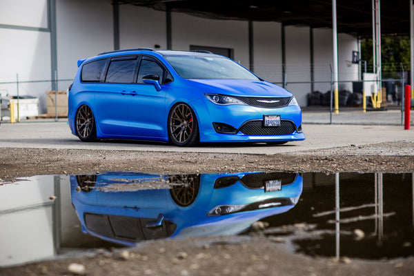 Clinched front lip and ducktail installed on a 2017-2020 Chrysler Pacifica, front three-quarter view
