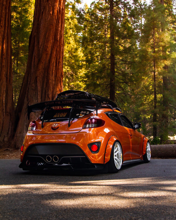 Hyundai Veloster with Clinched New School 7cm (2.8") universal fender flares, rear three-quarter view